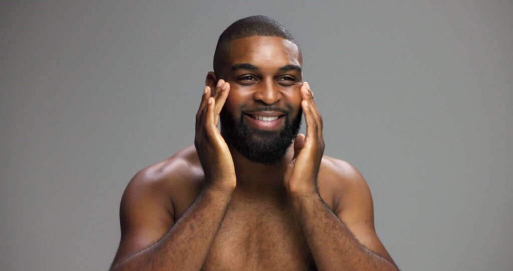 Man with healthy skin and relaxed expression illustrating natural results from male aesthetic treatments