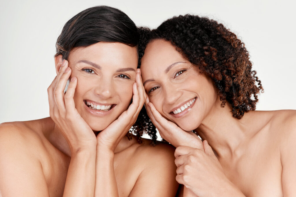 Two women with healthy radiant skin following natural non surgical facial rejuvenation treatments